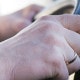 A close-up of a driver holding a steering wheel | manage accident risk