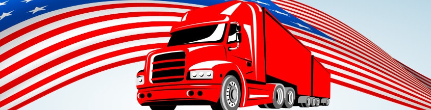 A red truck in front of the American Flag