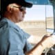 Distracted Driving Awareness Month Truck Driver on Phone